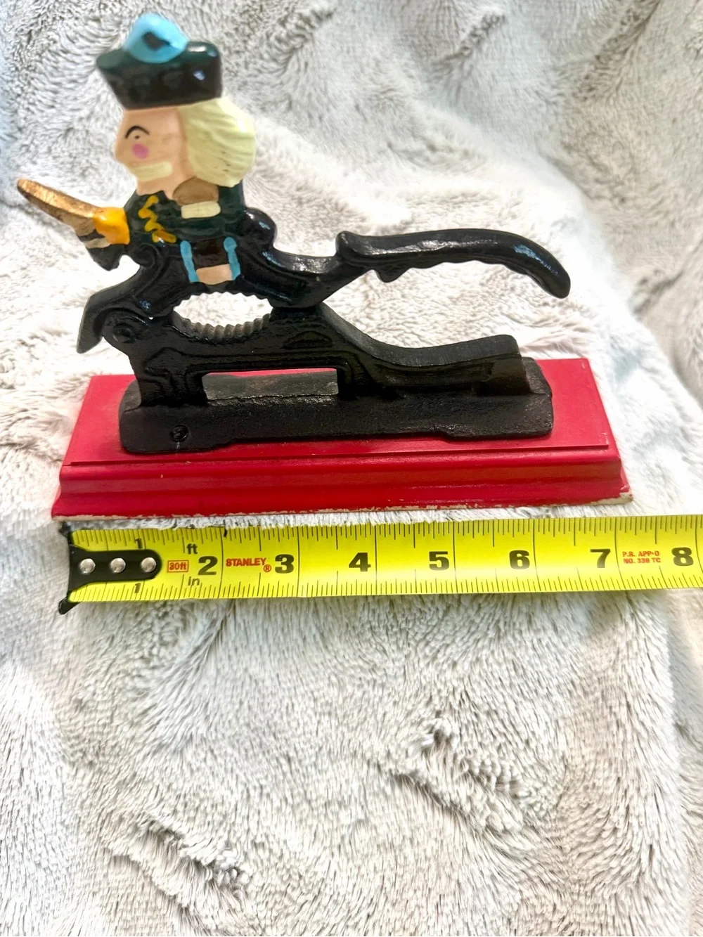 Vintage Cast Iron Nutcracker Figurine on Red Base